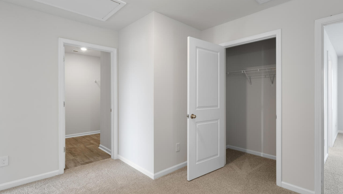 Upstairs, the Primary Suite offers a private bathroom, and the rest of the second floor includes three additional bedrooms and a convenient laundry room.