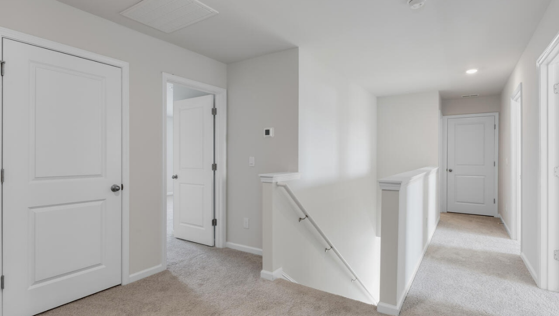 Upstairs, the Primary Suite offers a private bathroom, and the rest of the second floor includes three additional bedrooms and a convenient laundry room.
