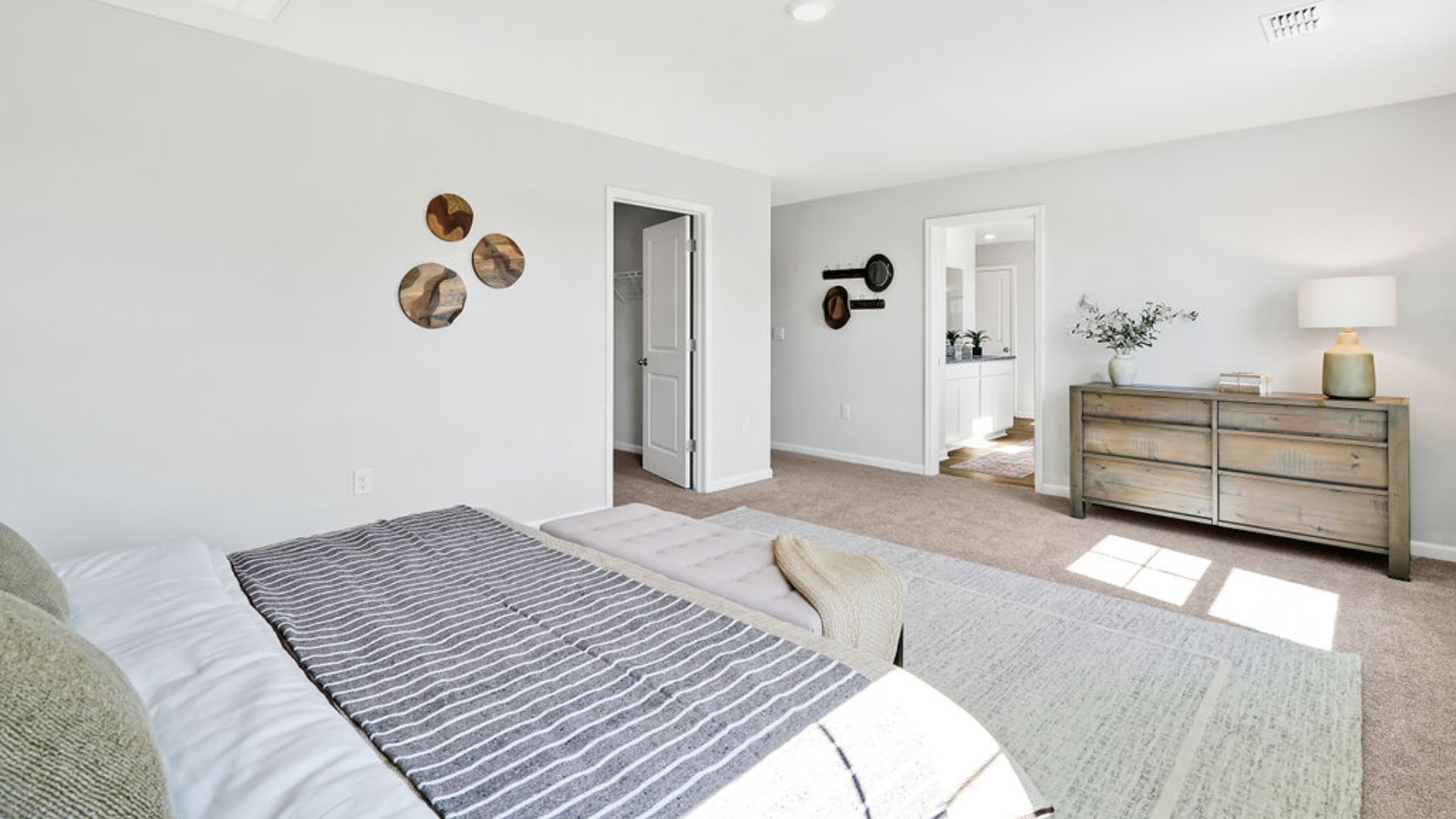 The primary bedroom has its own attached bathroom that features a walk-in closet and all the space you need to get ready in the morning