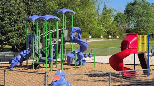 Recreation area featuring athletic fields and courts, trails, playgrounds, and a disc golf course.