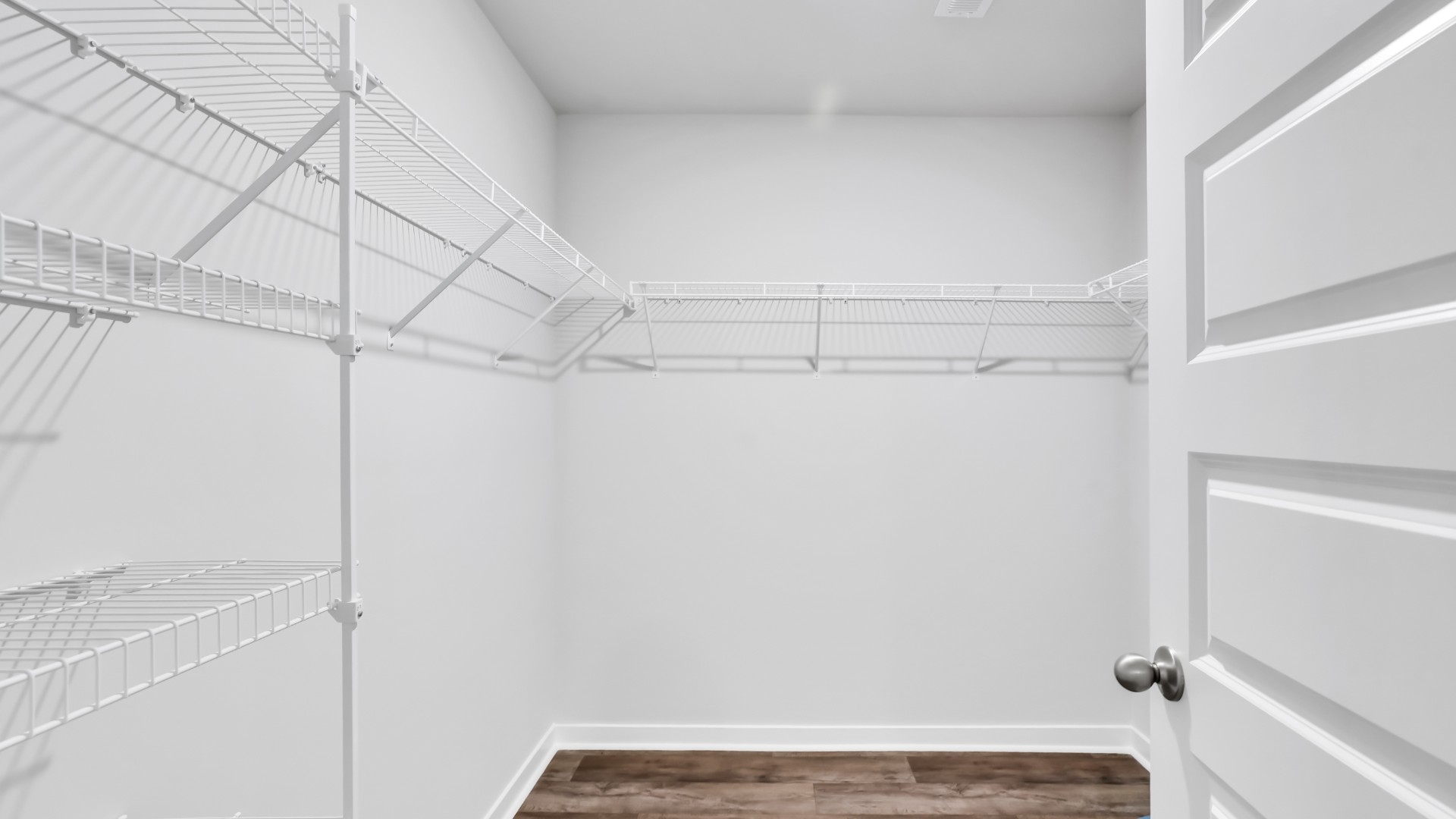 Need privacy? The primary suite is tucked away in the back of the home, offering a peaceful retreat complete with a walk-in shower (glass door included!), granite vanity, and a roomy walk-in closet.