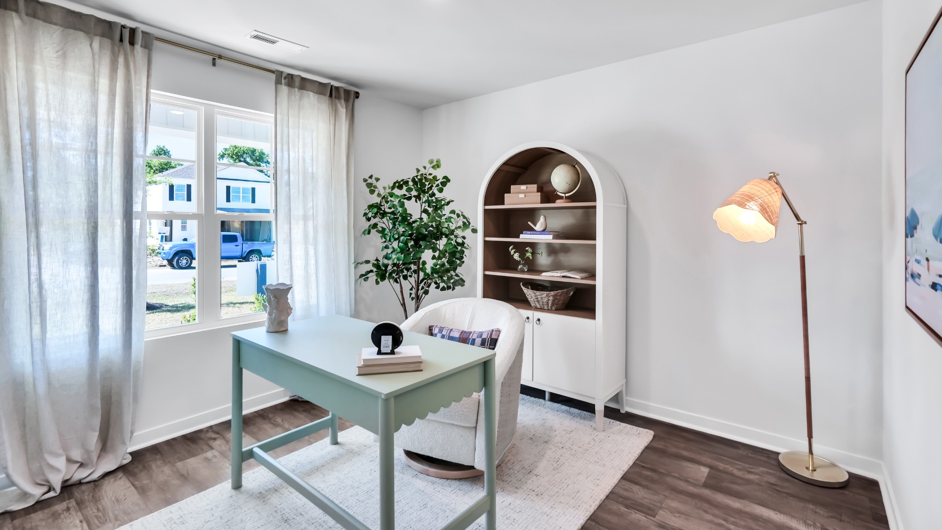 Three additional bedrooms are located up front- perfect for guests, kids, or a home office setup.