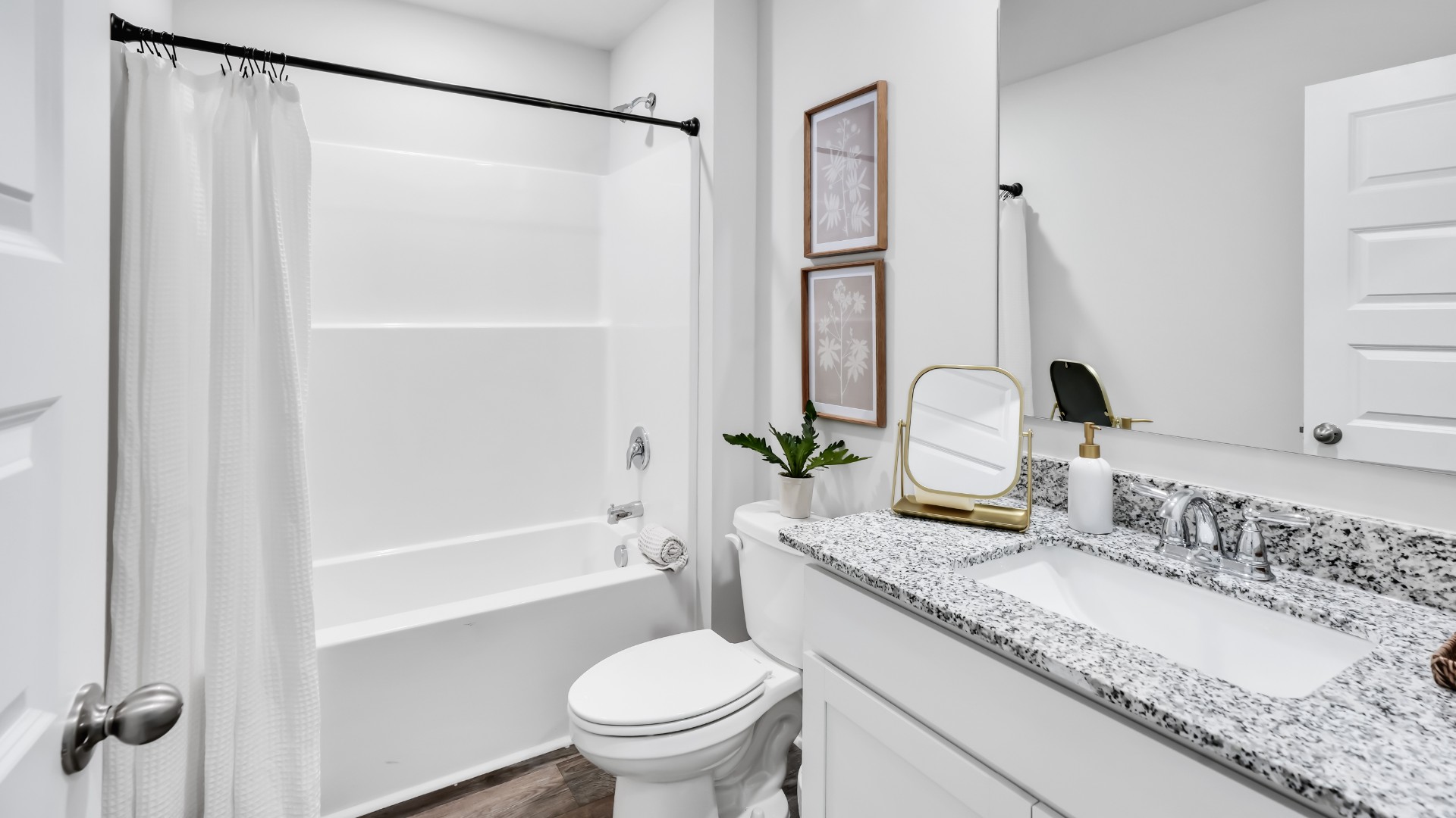 Three additional bedrooms are located up front- perfect for guests, kids, or a home office setup.