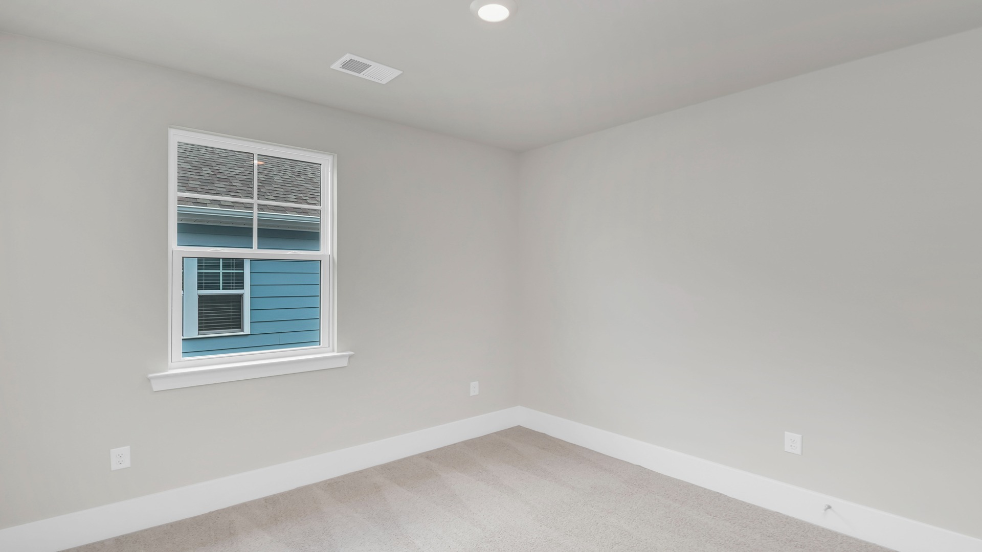 Bedroom 3 features carpet flooring and a window.