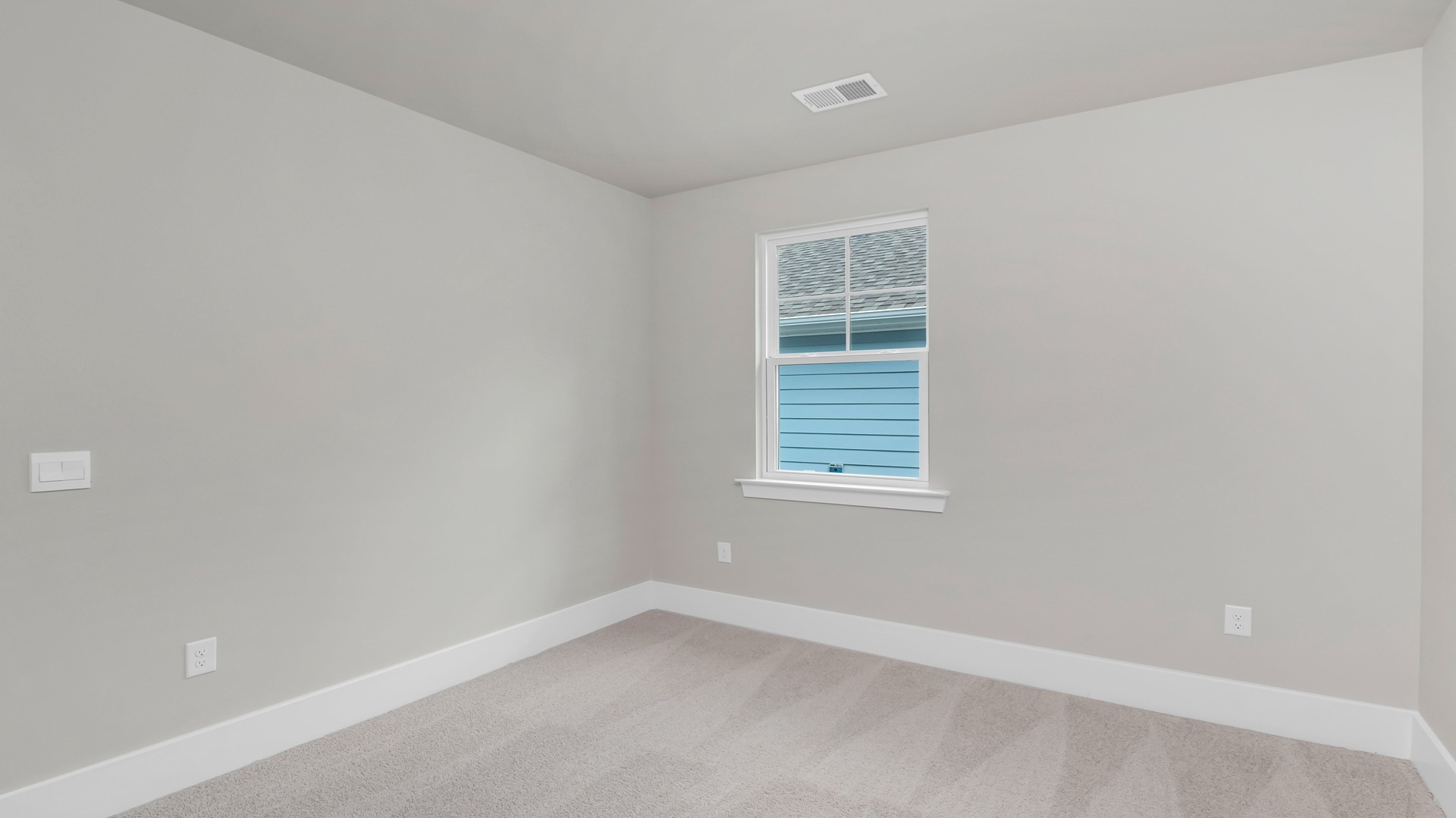 Bedroom 3 features carpet flooring and a window.