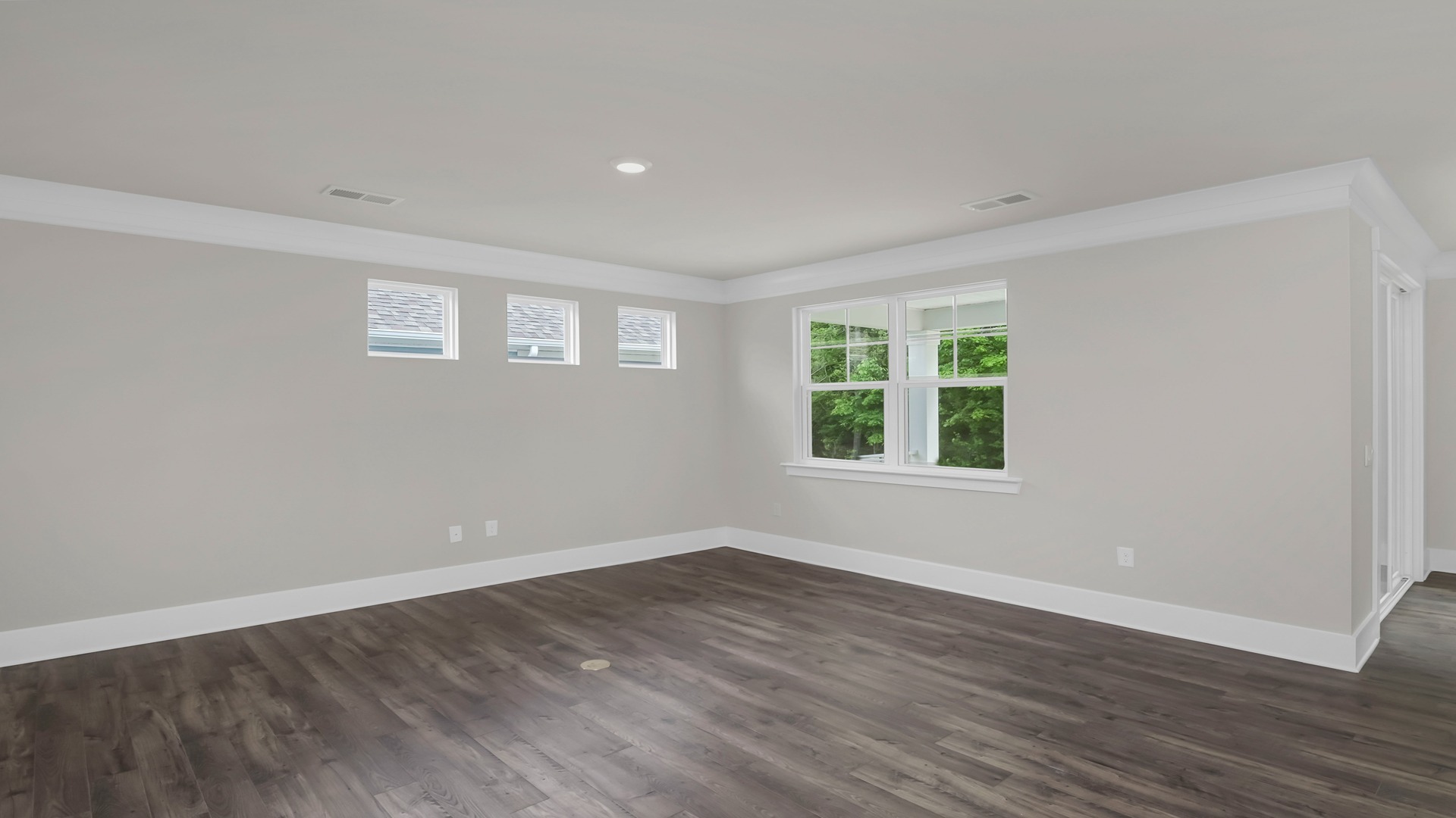 The living area features several windows for light.