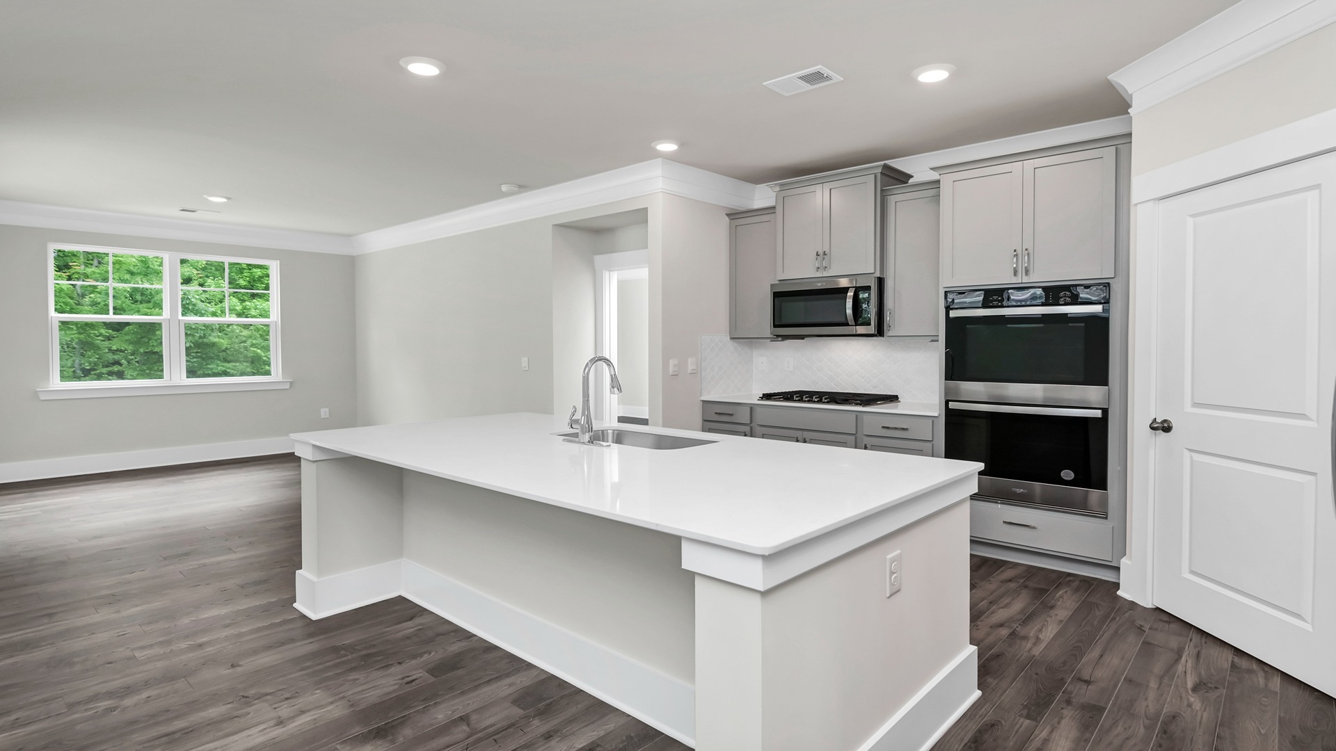 There is space for barstool seating at the floating kitchen island.