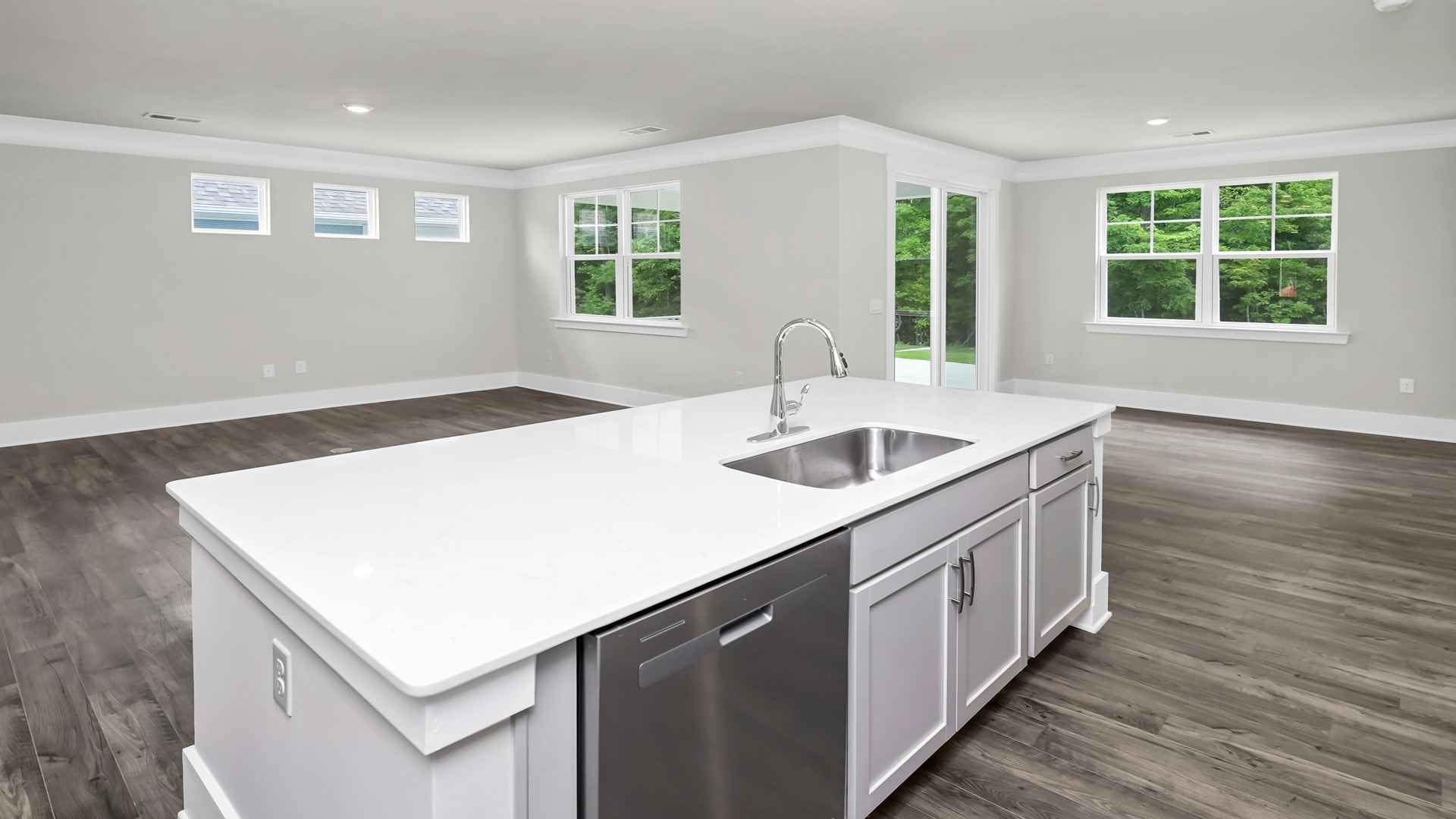 The floating kitchen island overlooks the dining and living areas.