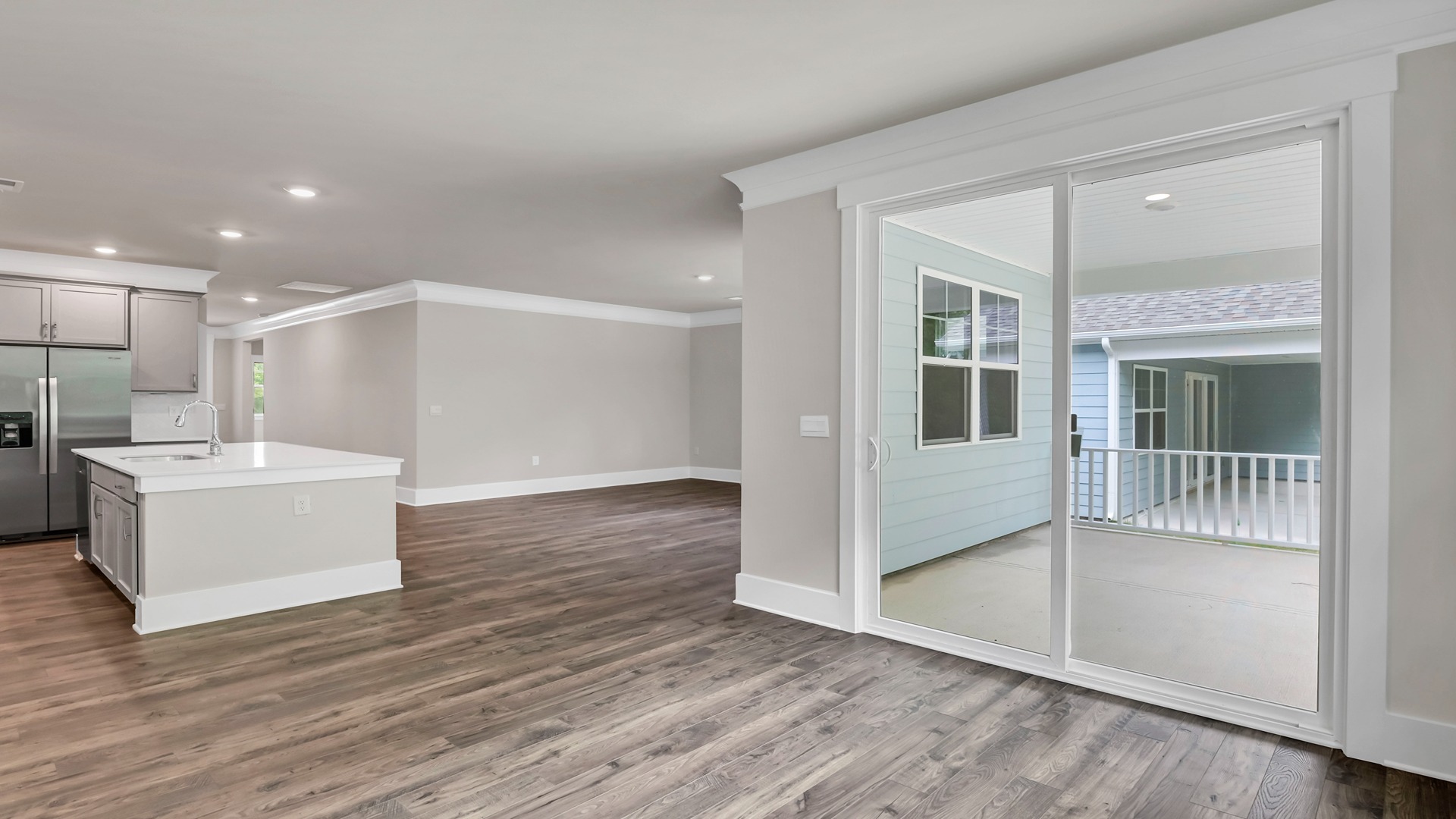 Access to the back patio through glass sliding doors in the dining area.