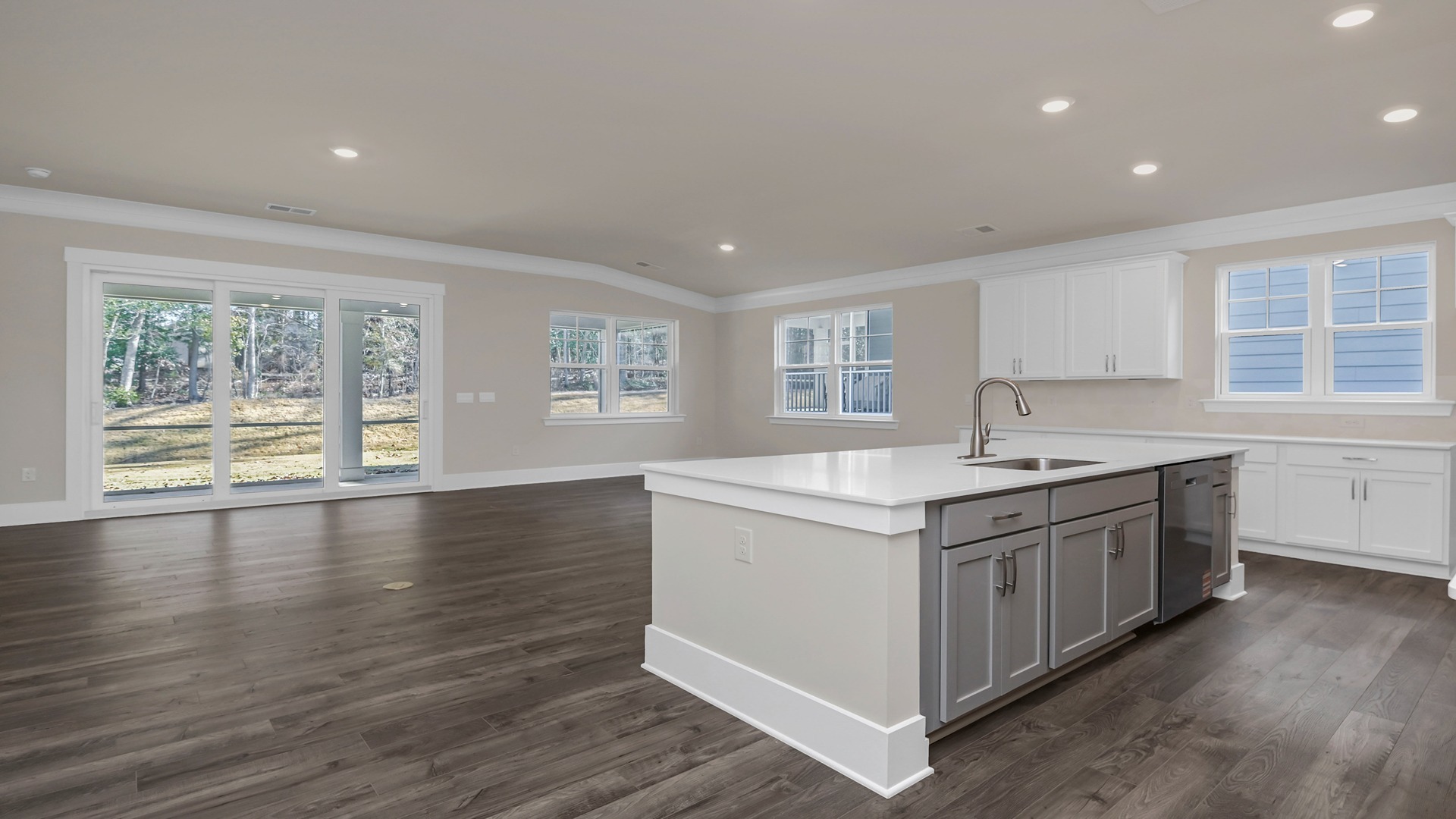 Open kitchen, dining, and living areas with lots of natural light