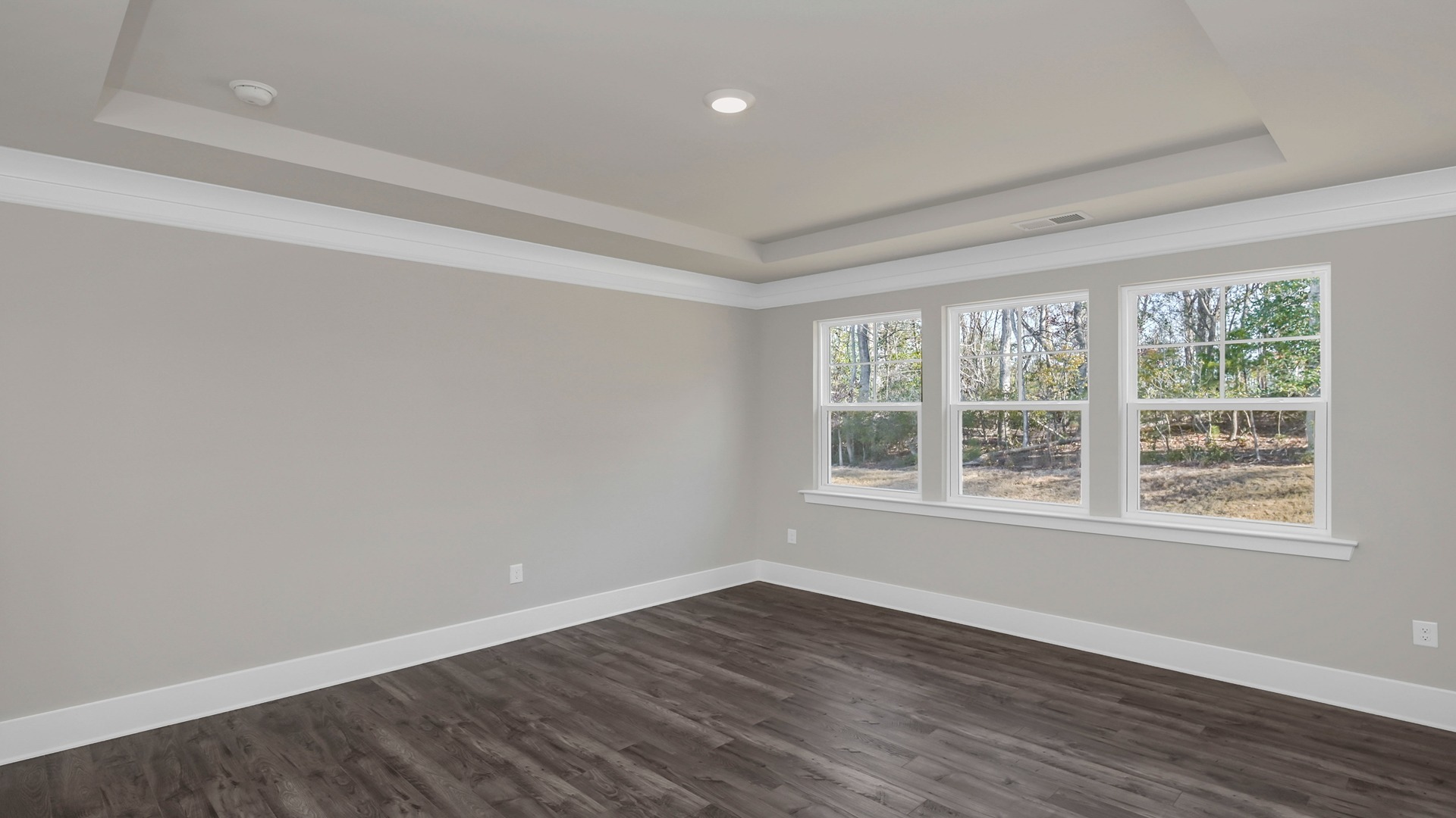 Private primary suite at the back of the home