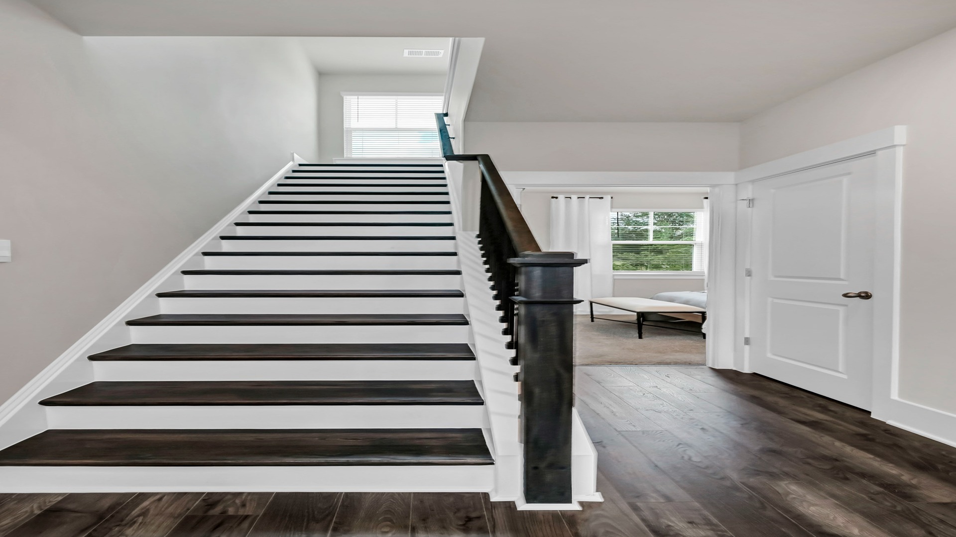 Oak tread stairs lead to upstairs.