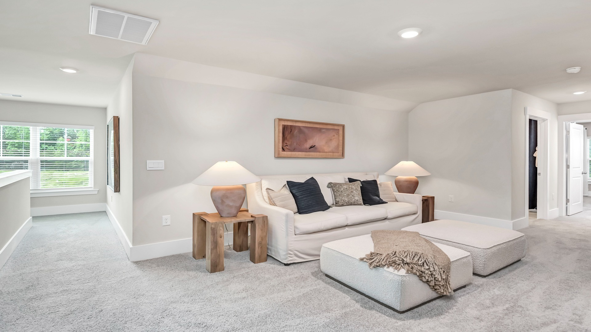 There is a secondary living room upstairs that is spacious and carpeted.