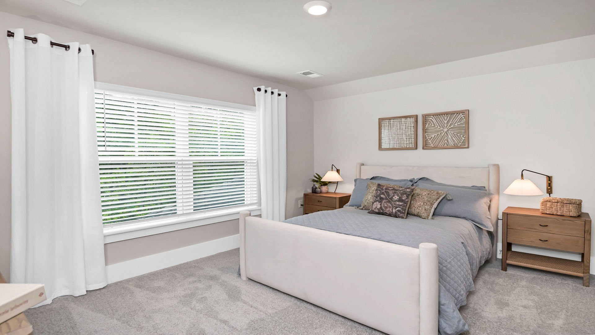 Bedroom 4 upstairs with a large window and carpet flooring