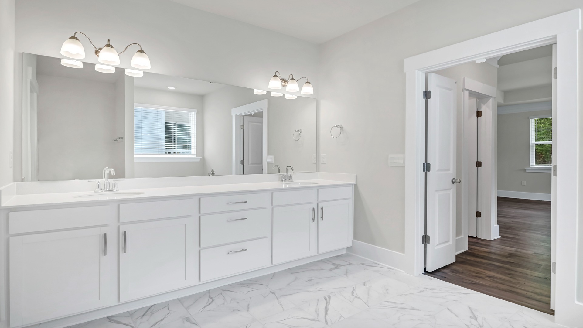 Double primary vanity with white cabinetry