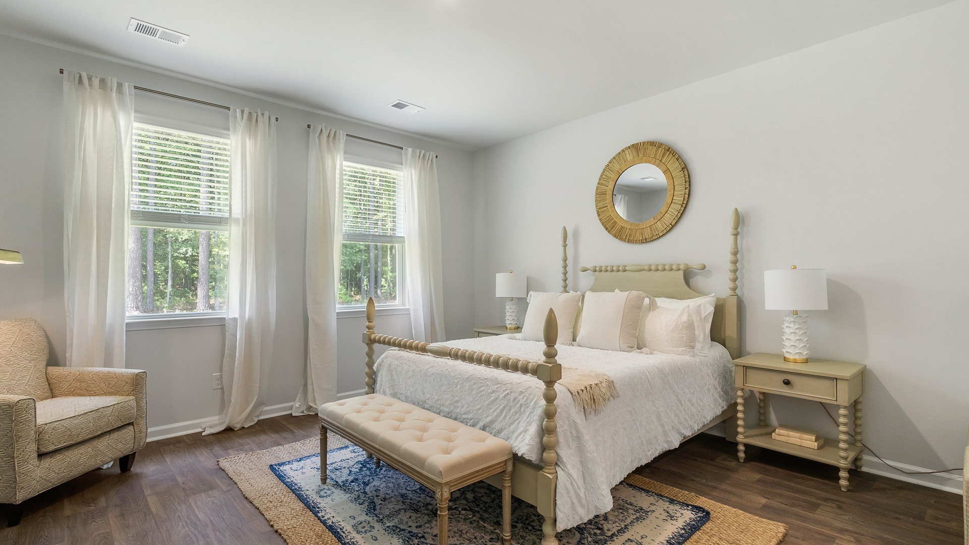 Several large windows in the primary bedroom for natural light