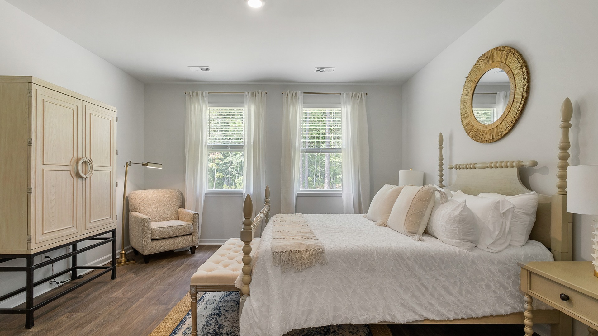 Several large windows in the primary bedroom for natural light