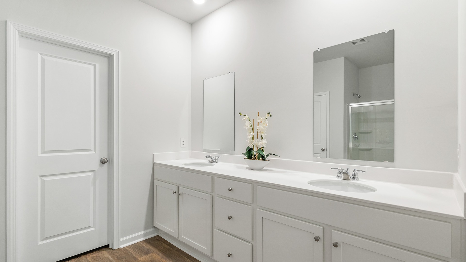 The primary bedroom features double sinks.
