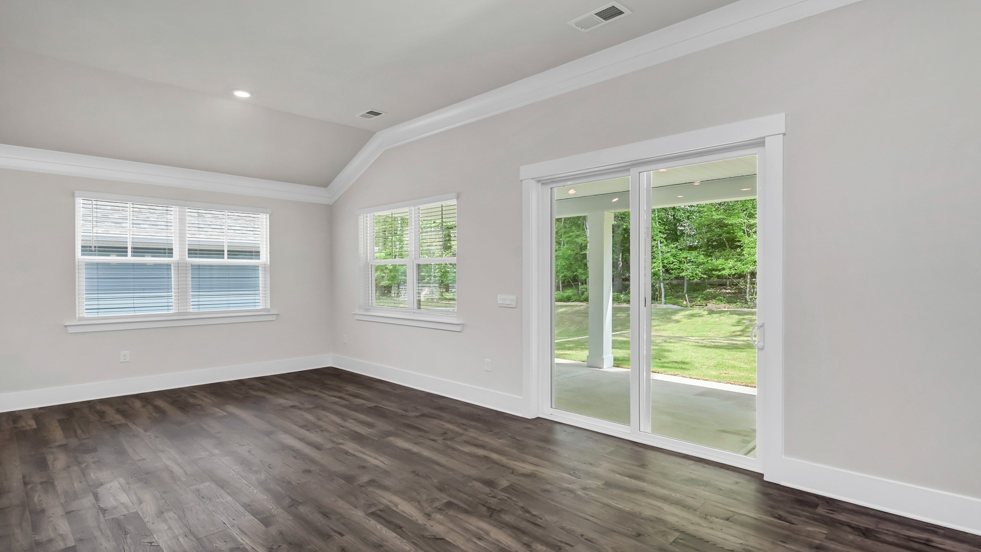 Sliding doors at back of home lead to back patio