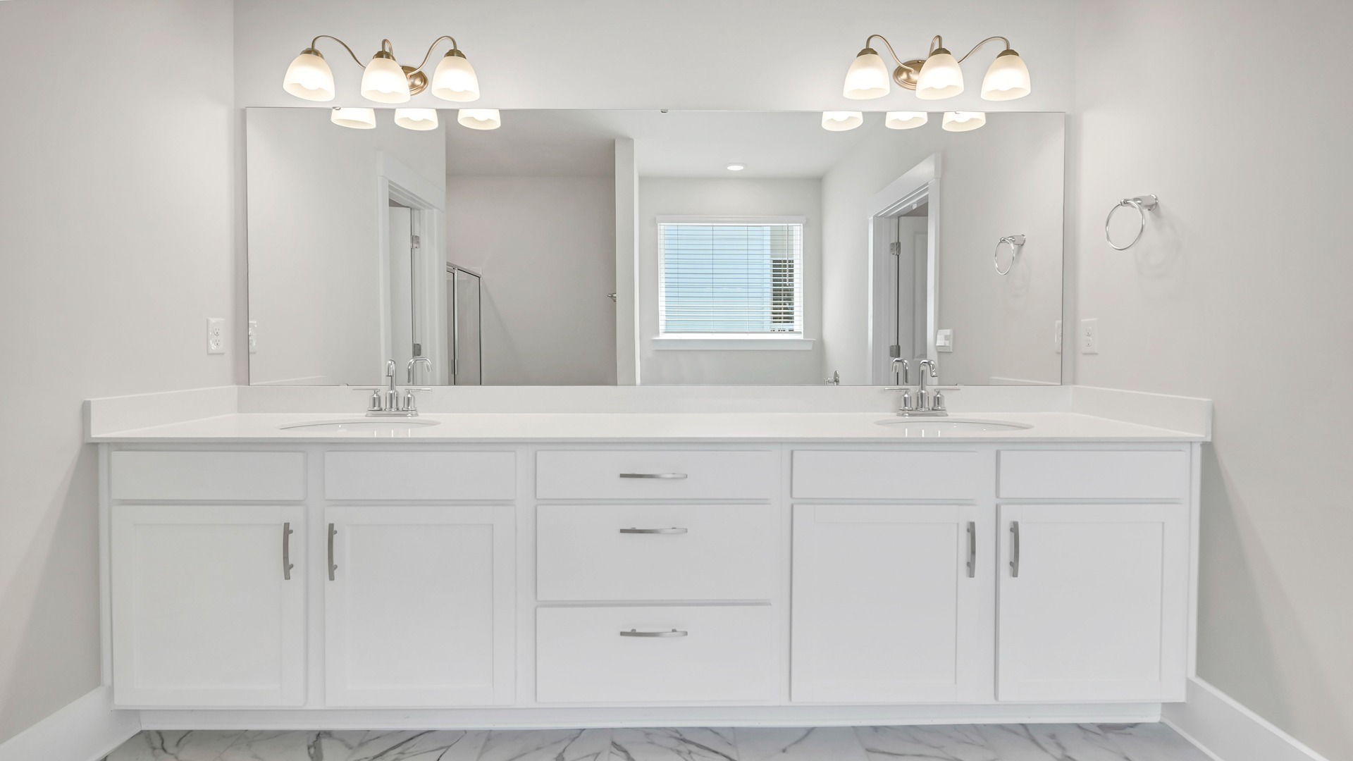 Double primary vanity with white cabinetry