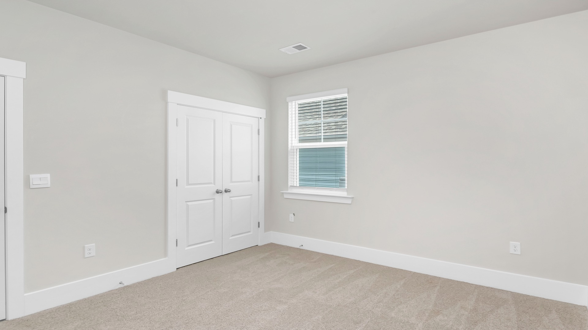 Bedroom 4 with carpet flooring and a private closet