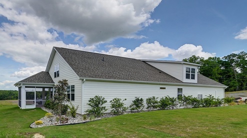 Back and side exterior of this home finished with durable Hardie Plank siding.