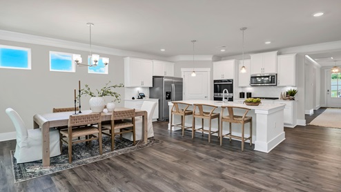 The kitchen and dining areas are open concept.