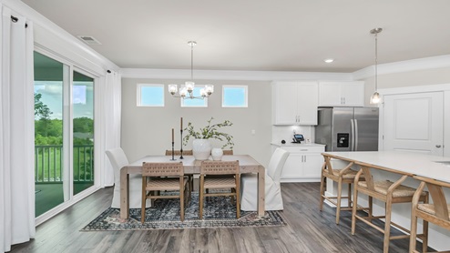 There is ample natural light in the dining area and kitchen from several windows.