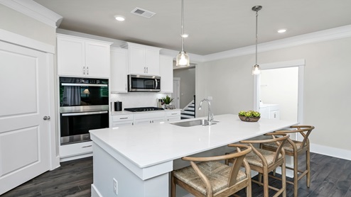 There is room for barstool seating at the floating kitchen island.