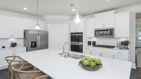 There is a spacious corner pantry in the kitchen.