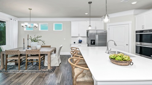 The kitchen and dining areas are open concept.
