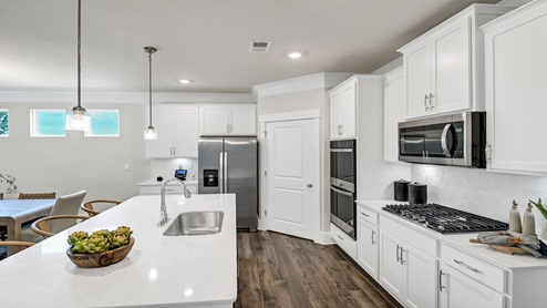 There is a spacious corner pantry in the kitchen.