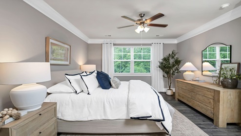 The primary bedroom is located off the living area towards the back of the home.