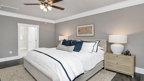 The primary bedroom spacious and comfortably fits a king bed.