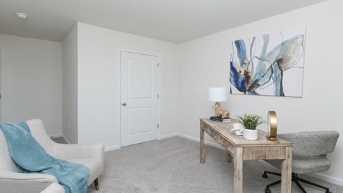 Bedroom 3 is located upstairs and is staged as an office space.