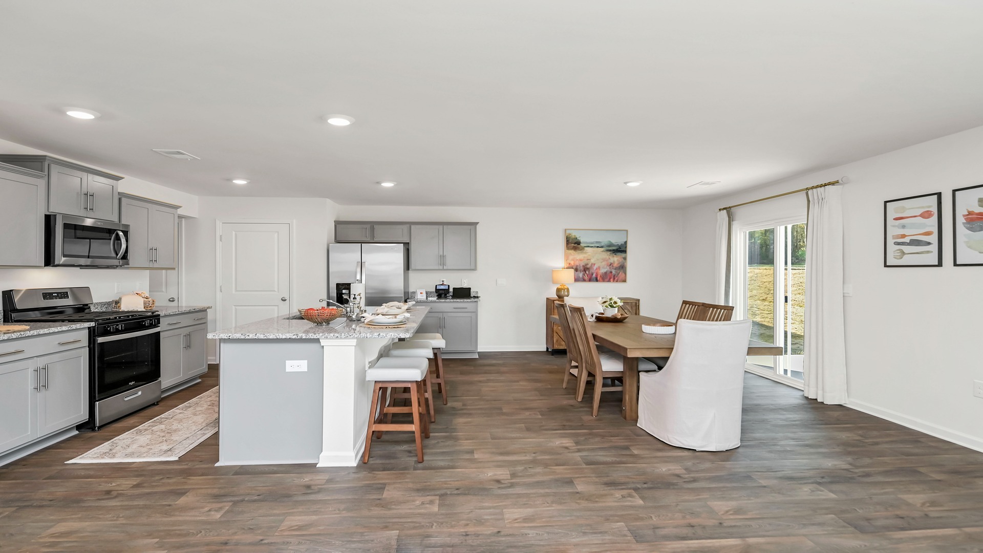 Vinyl flooring throughout the first floor of this two-story new construction home