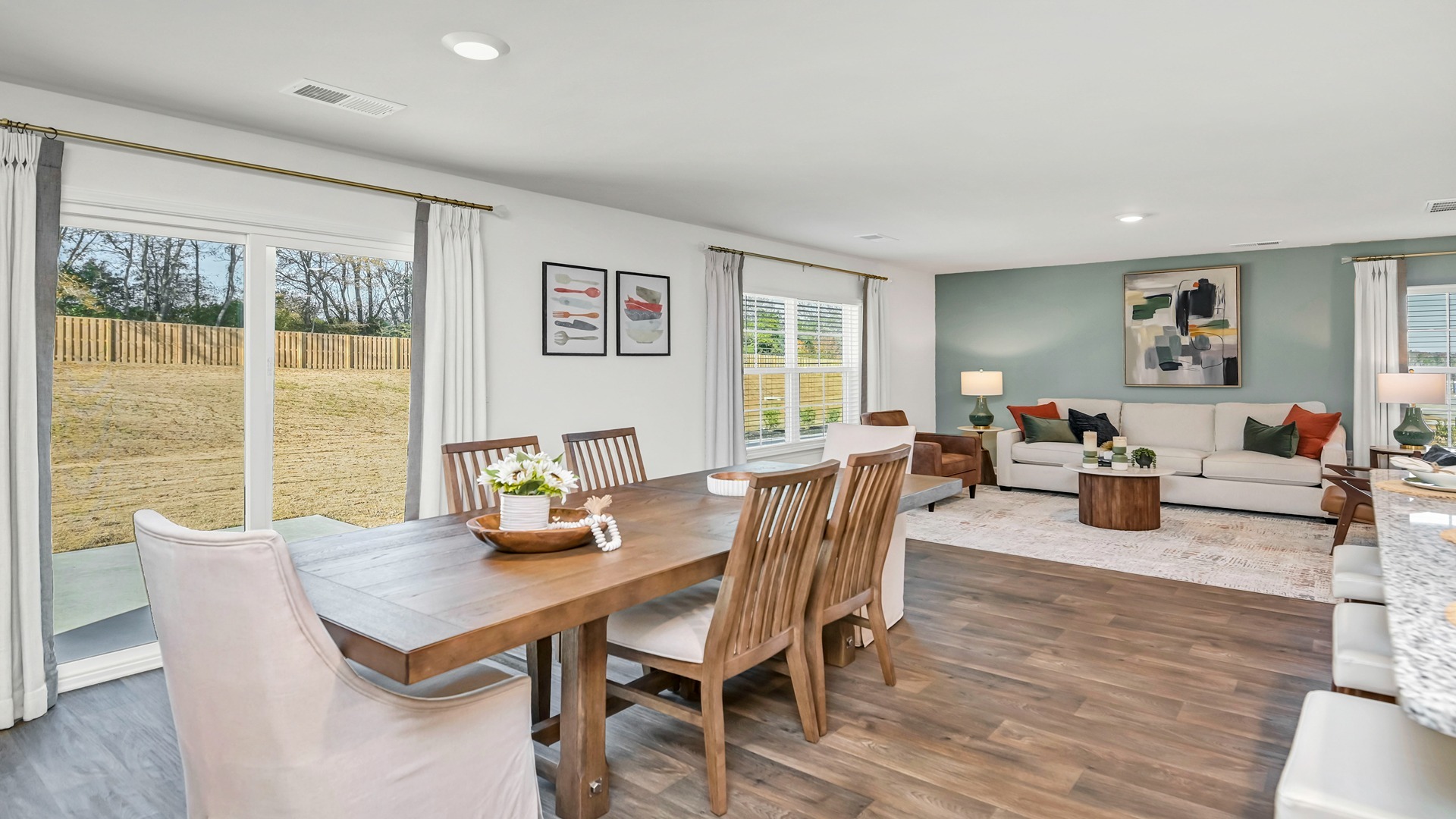 Dining and living areas with natural light