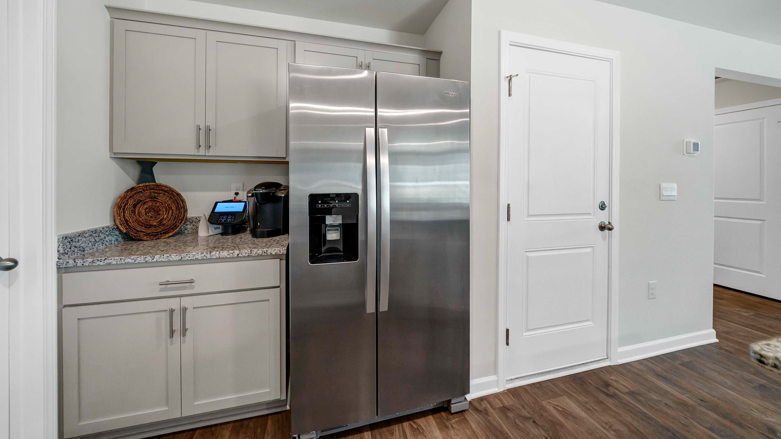 Garage door entry leads to the kitchen space