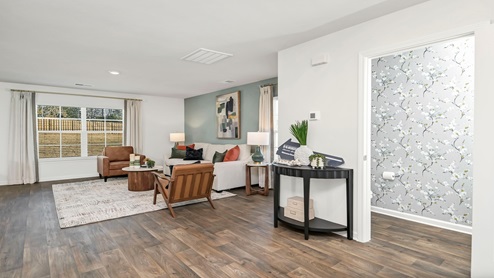 Living area and first-floor powder room.