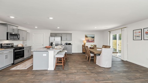 Open concept dining and kitchen areas.