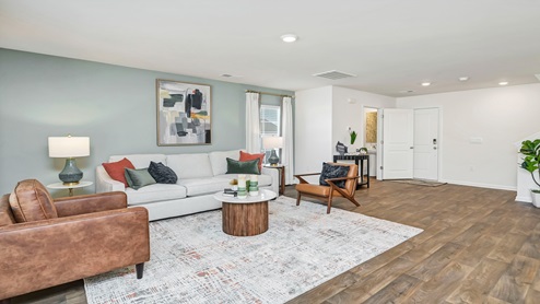 Spacious Aisle living room and view of front door.