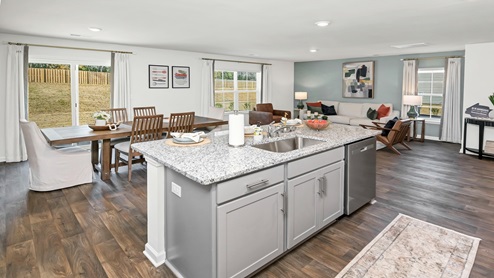 The kitchen has a floating kitchen island for extra countertop space.