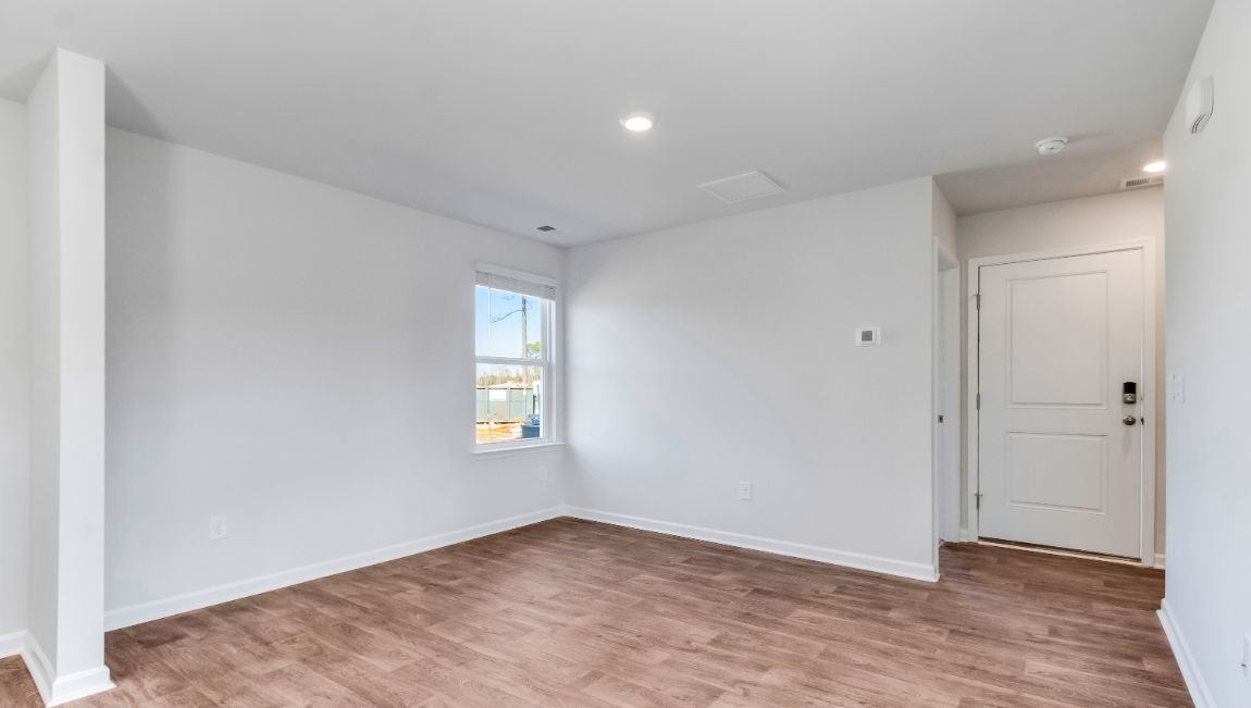 Front entrance opens up and leads into the open living area