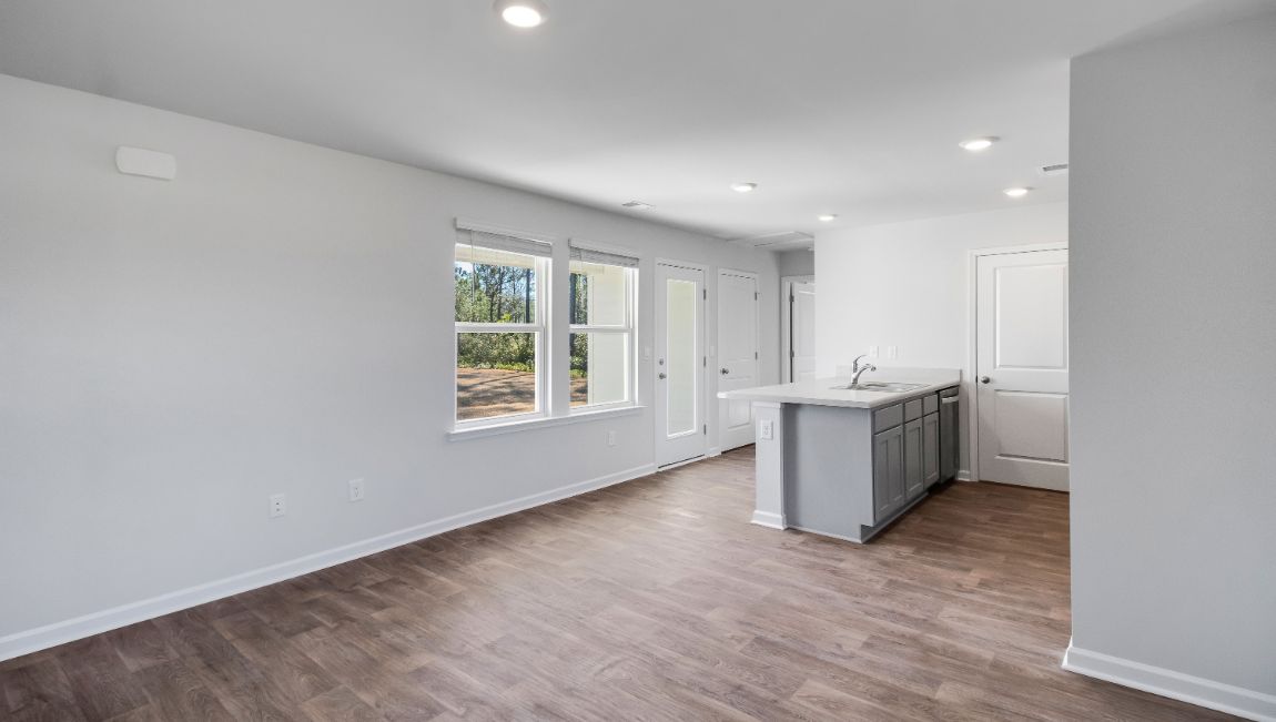 Vinyl flooring and natural light in the main living areas of The Hannah floorplan
