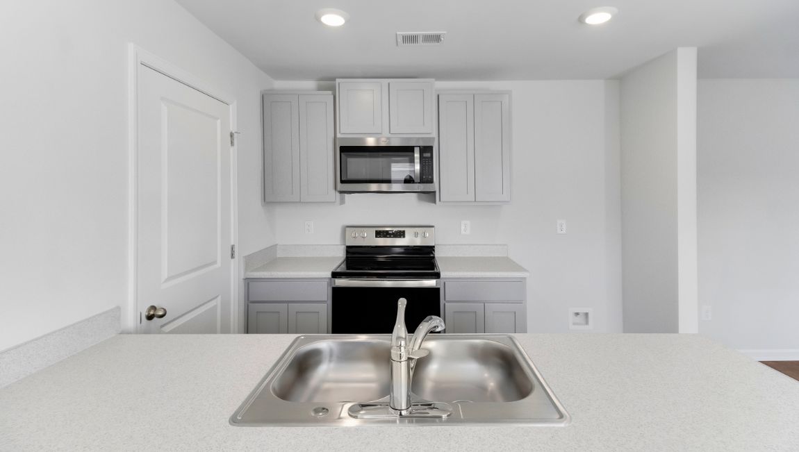 Stainless steel appliances come with the new construction kitchen