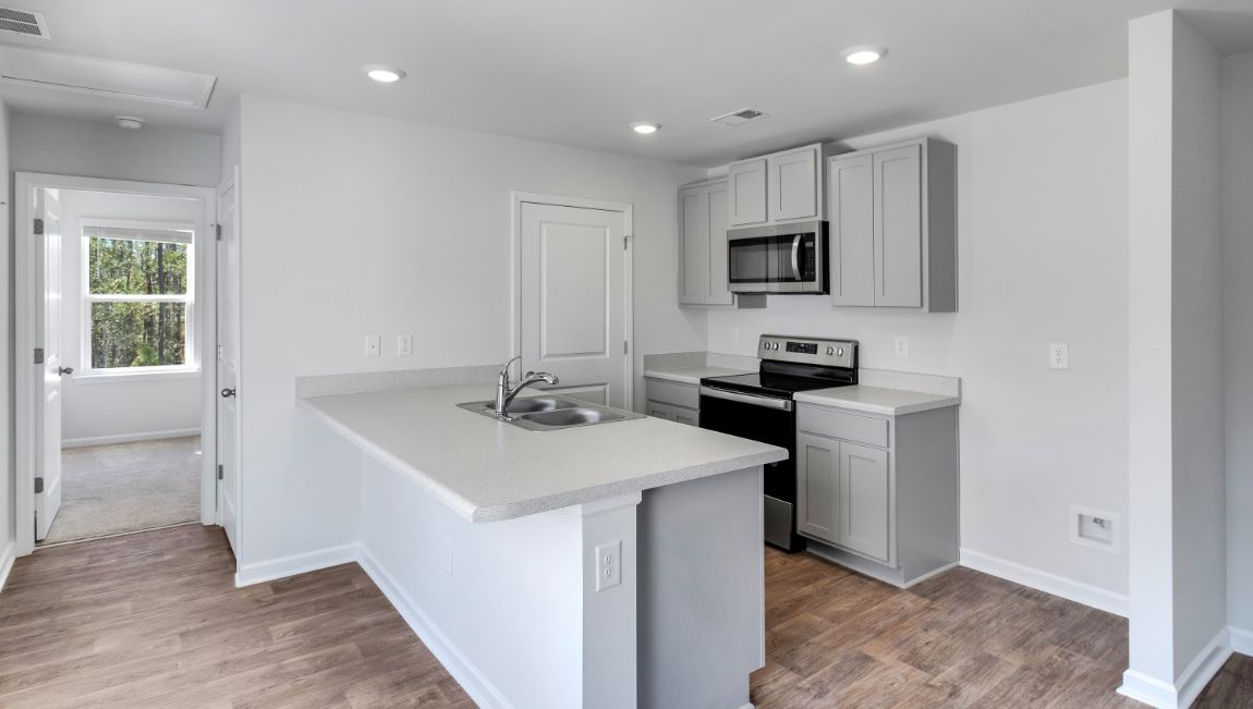 Hannah kitchen with a kitchen bar and shaker-style cabinetry