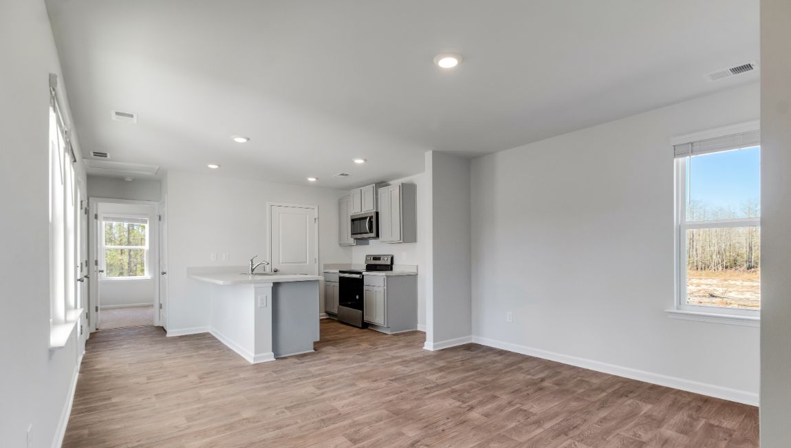 Open concept kitchen and living areas in new construction home in Orangeburg, SC