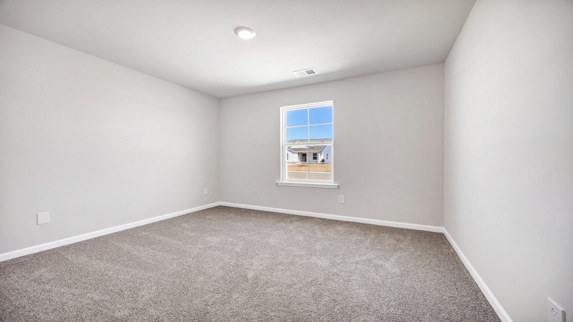 Bedroom 2 with carpet flooring, a window, and private closet