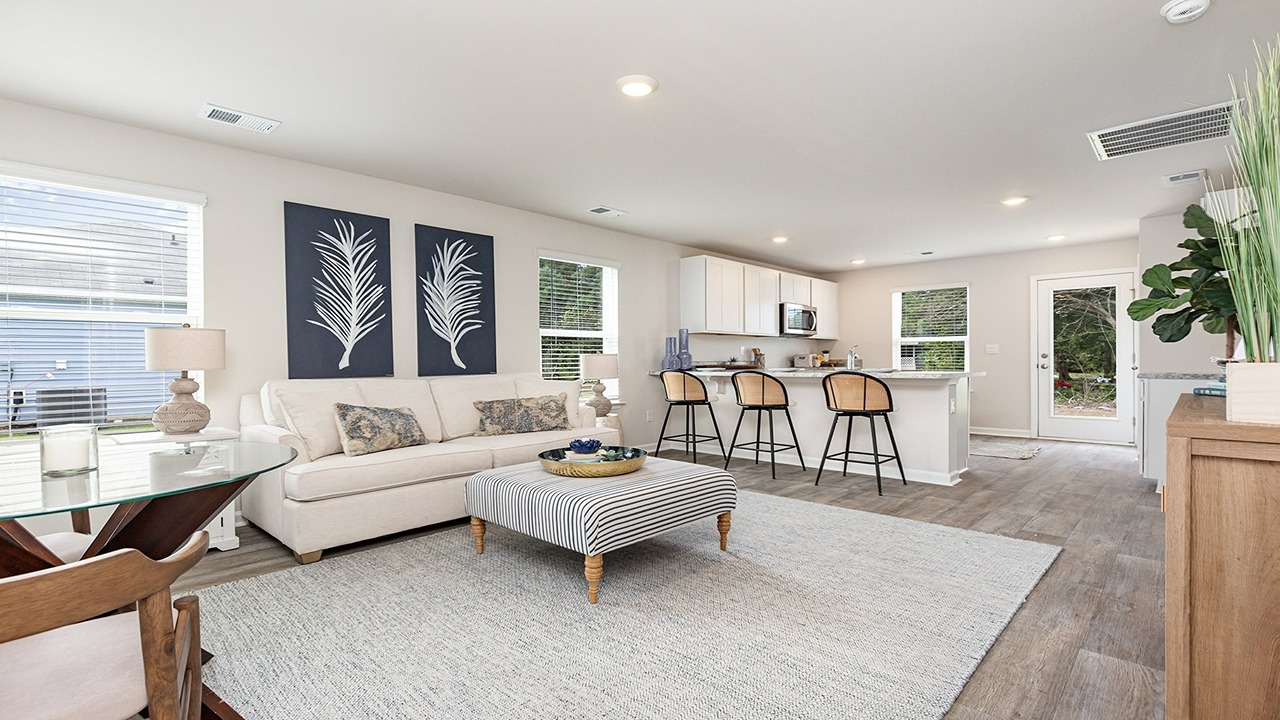 Open kitchen and living areas with vinyl flooring