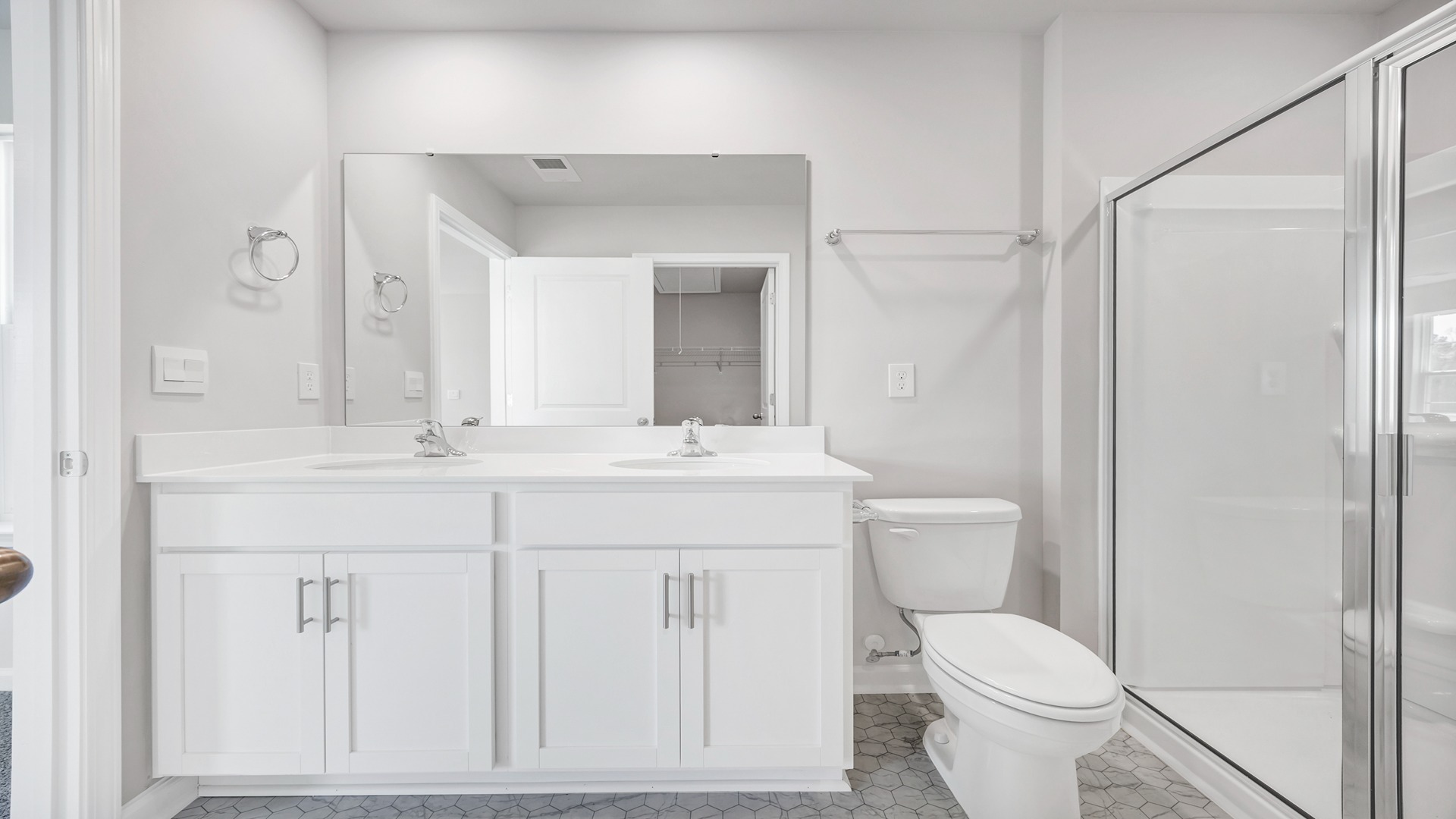Double primary vanity with white cabinetry
